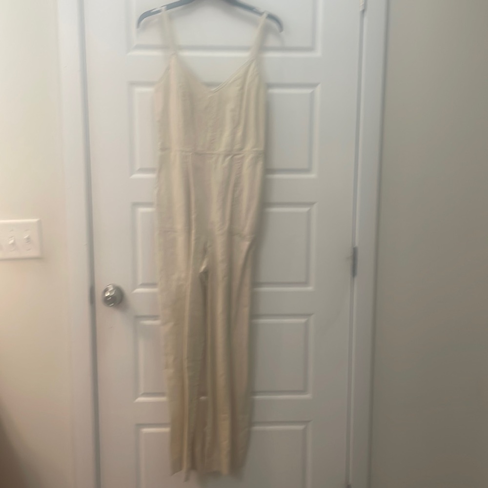 Universal Thread jumpsuit. Small straps, zips up the side.